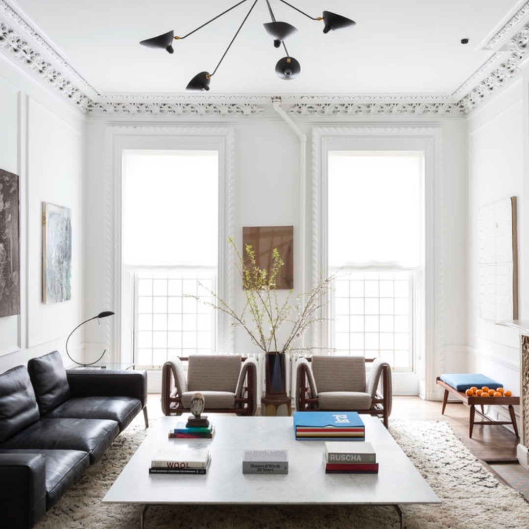 a living room with two couches and a coffee table