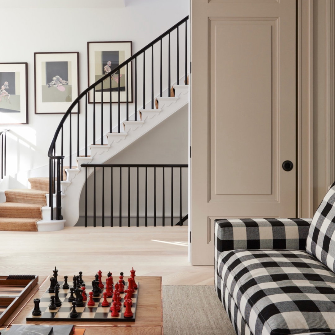 a living room filled with furniture and a chess board