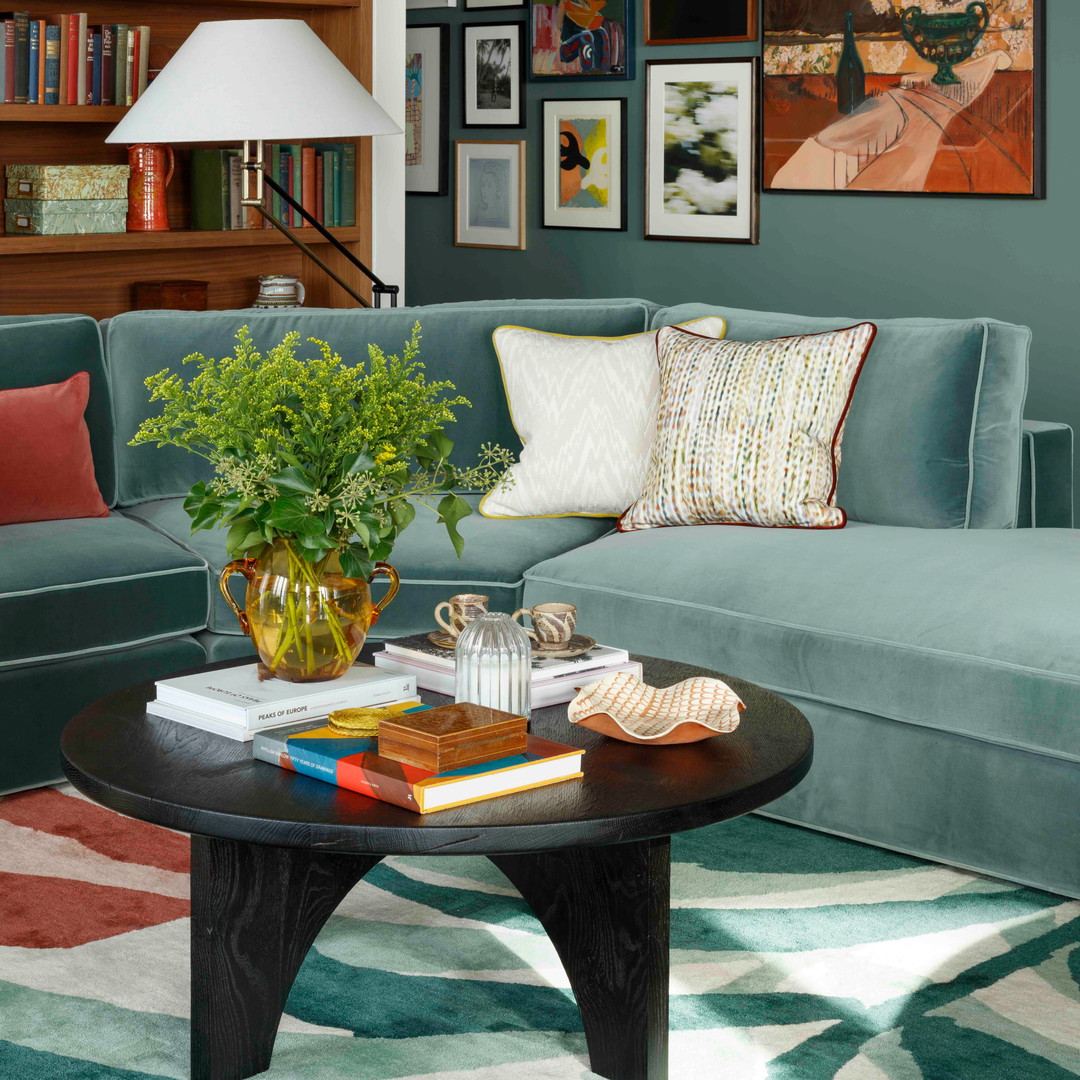 a living room filled with furniture and a coffee table