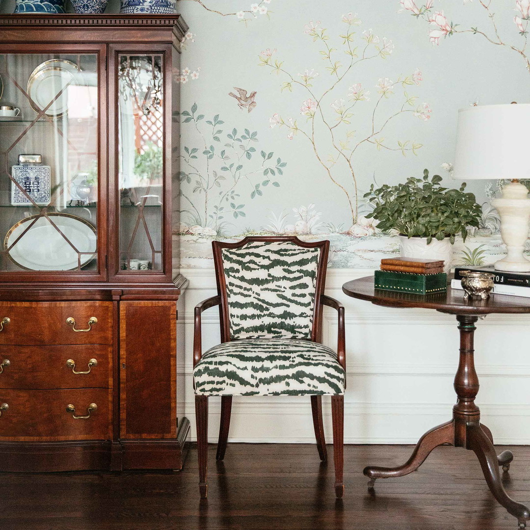 a room with a china cabinet and a china cabinet