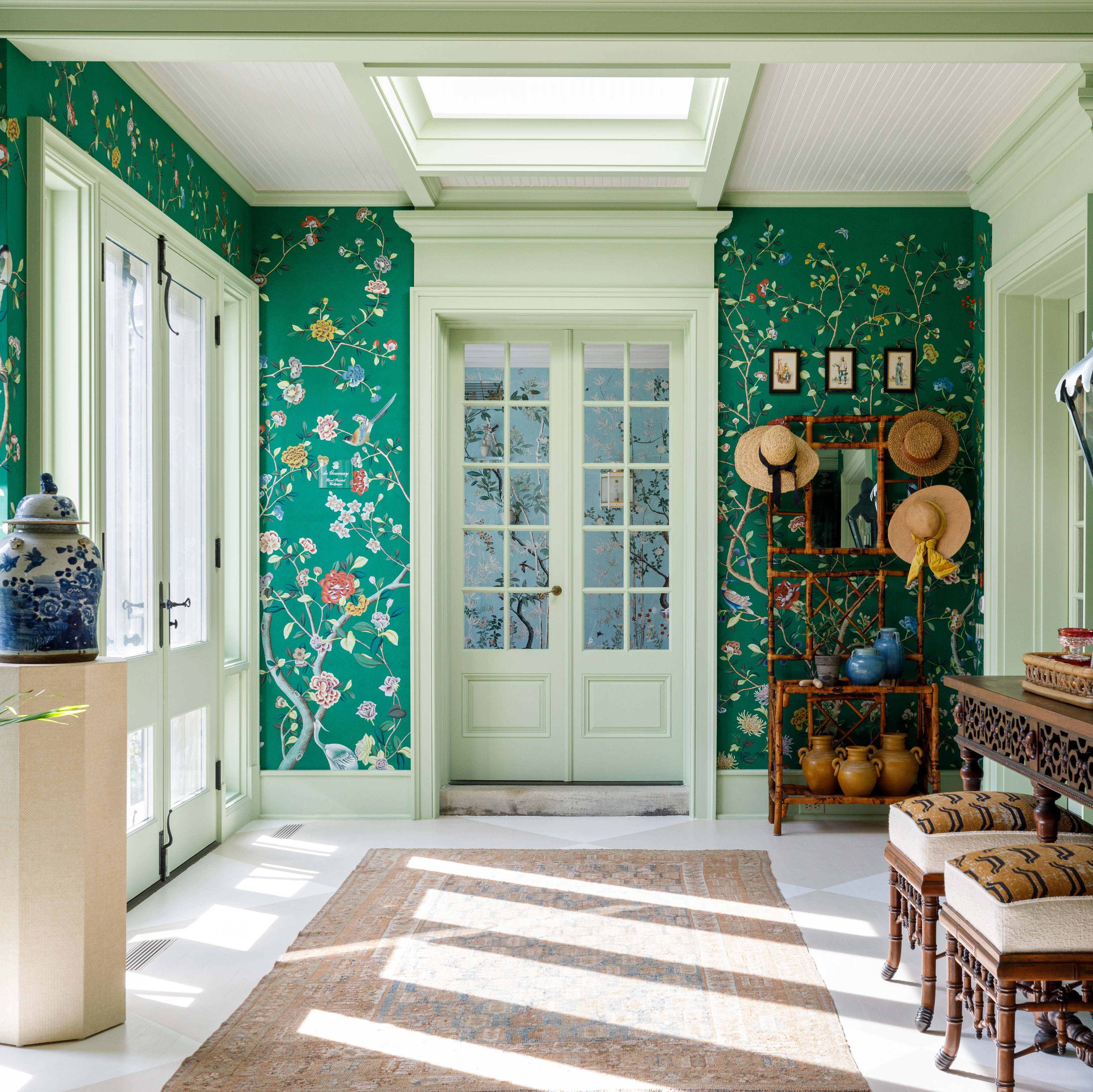 a room with green walls and a white ceiling