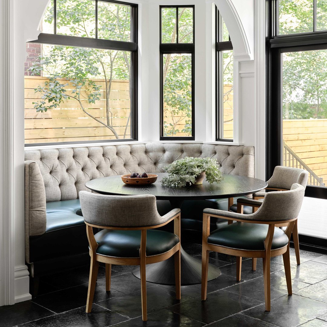 a dining room with a bench and a table