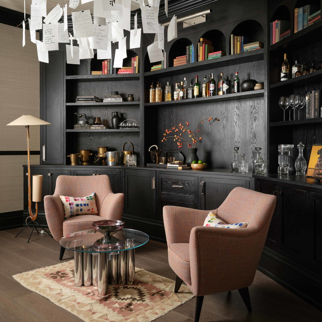 a living room with two chairs and a coffee table