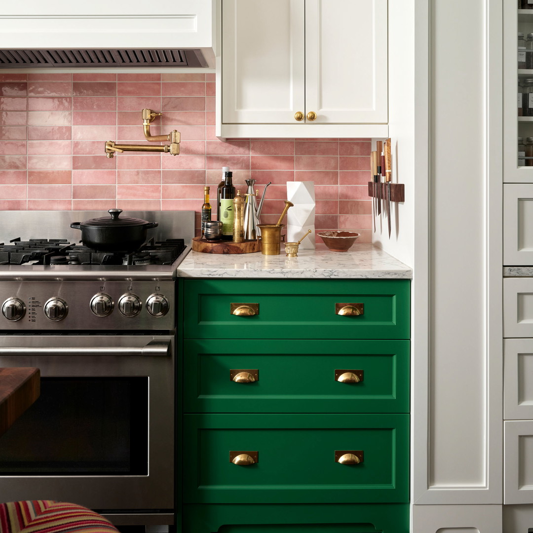 a kitchen with green drawers and a stove