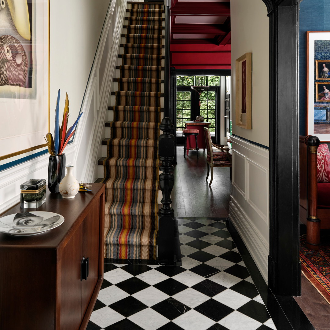 a black and white checkered floor and stairs