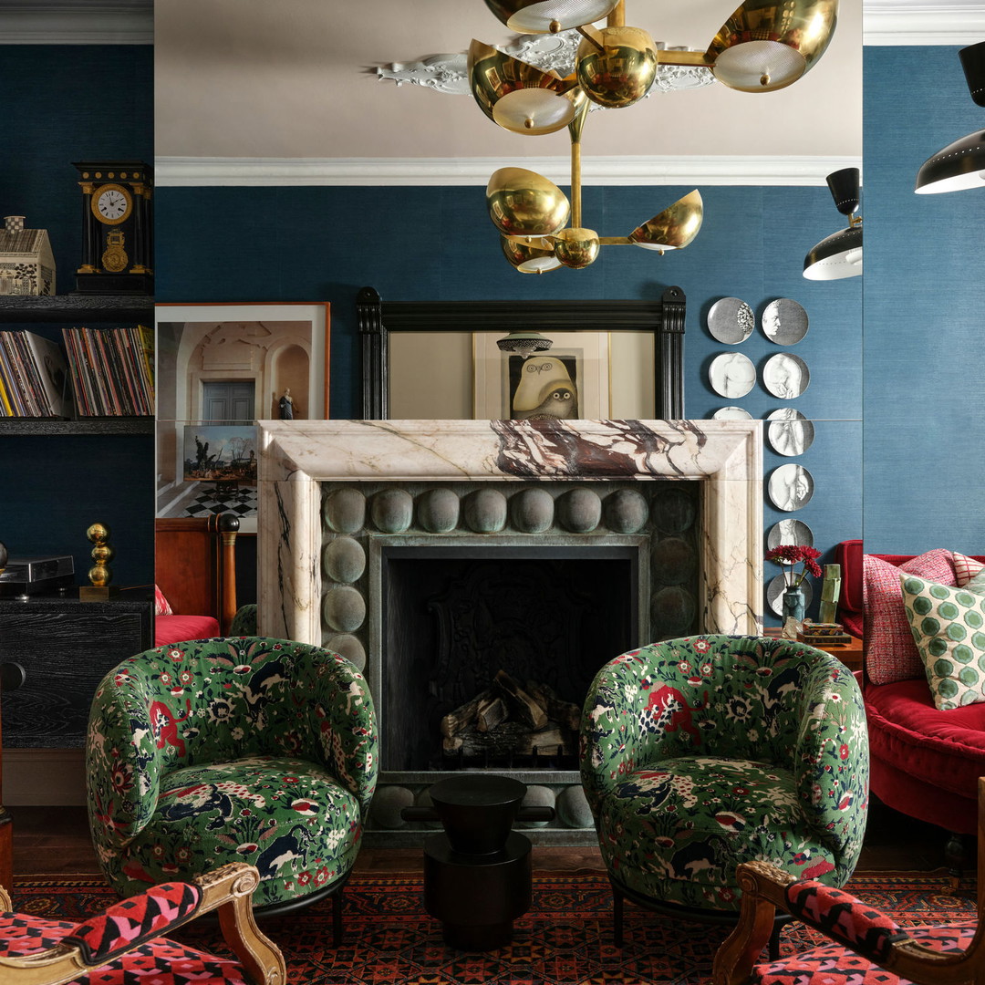 a living room filled with furniture and a fire place