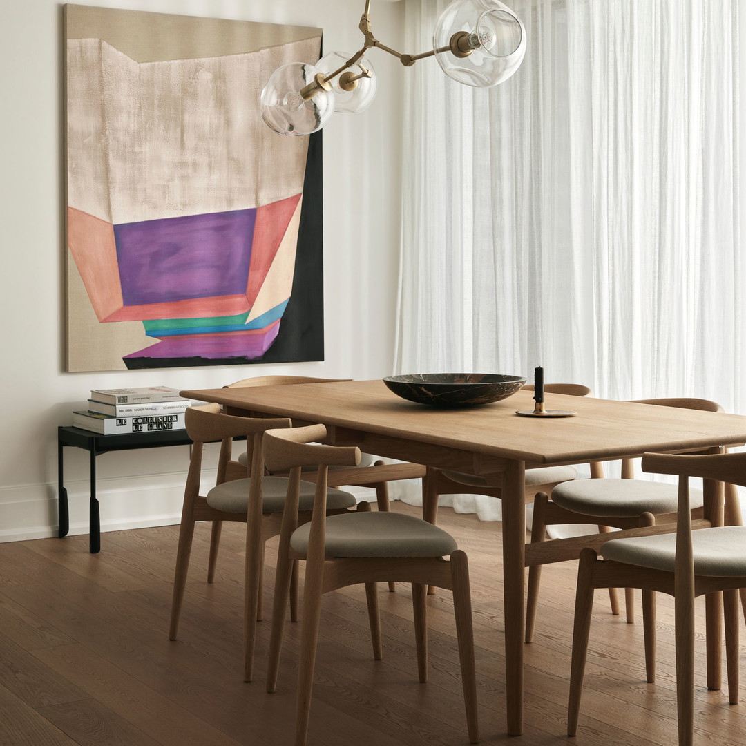 a dining room with a table and chairs