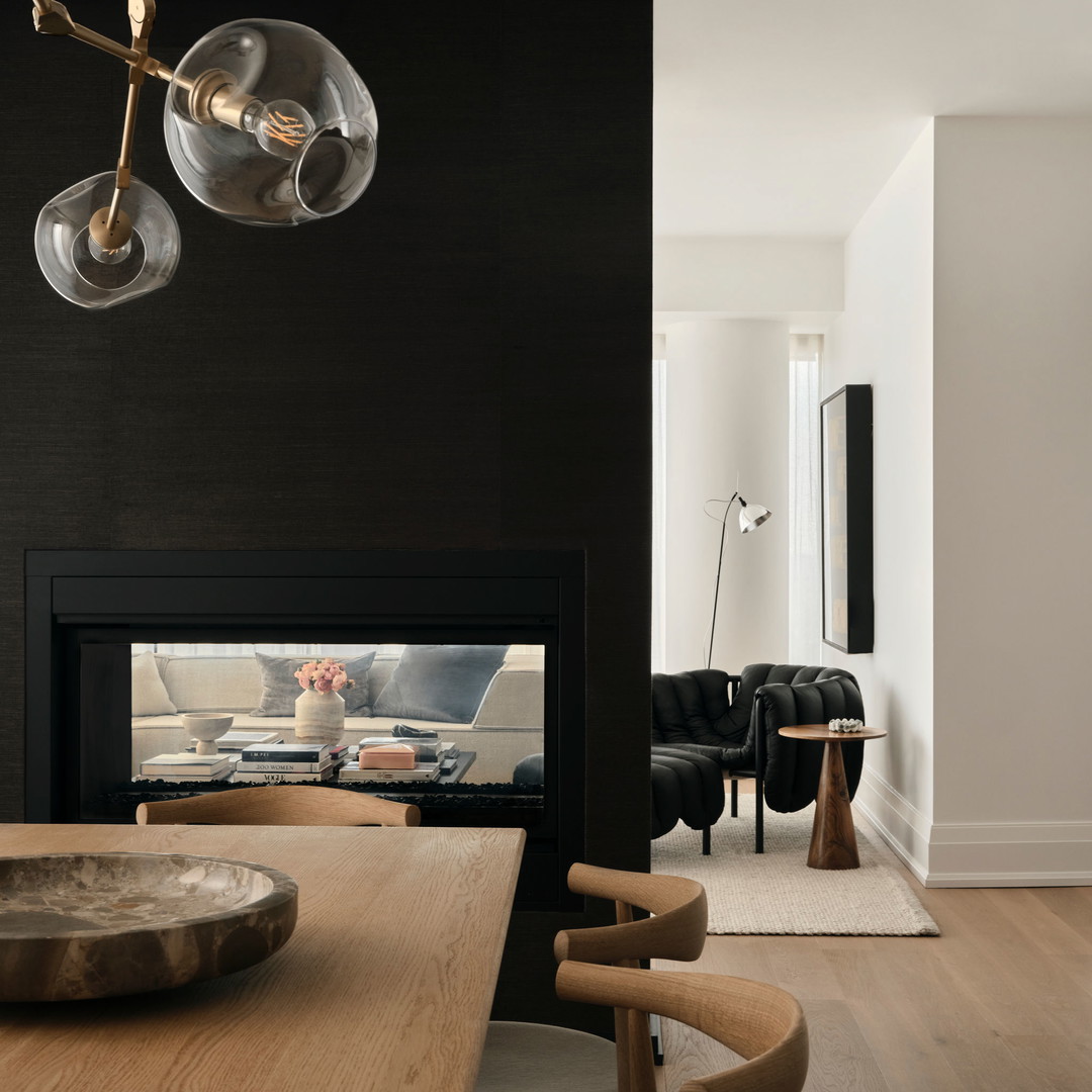 a living room with a fire place and a table