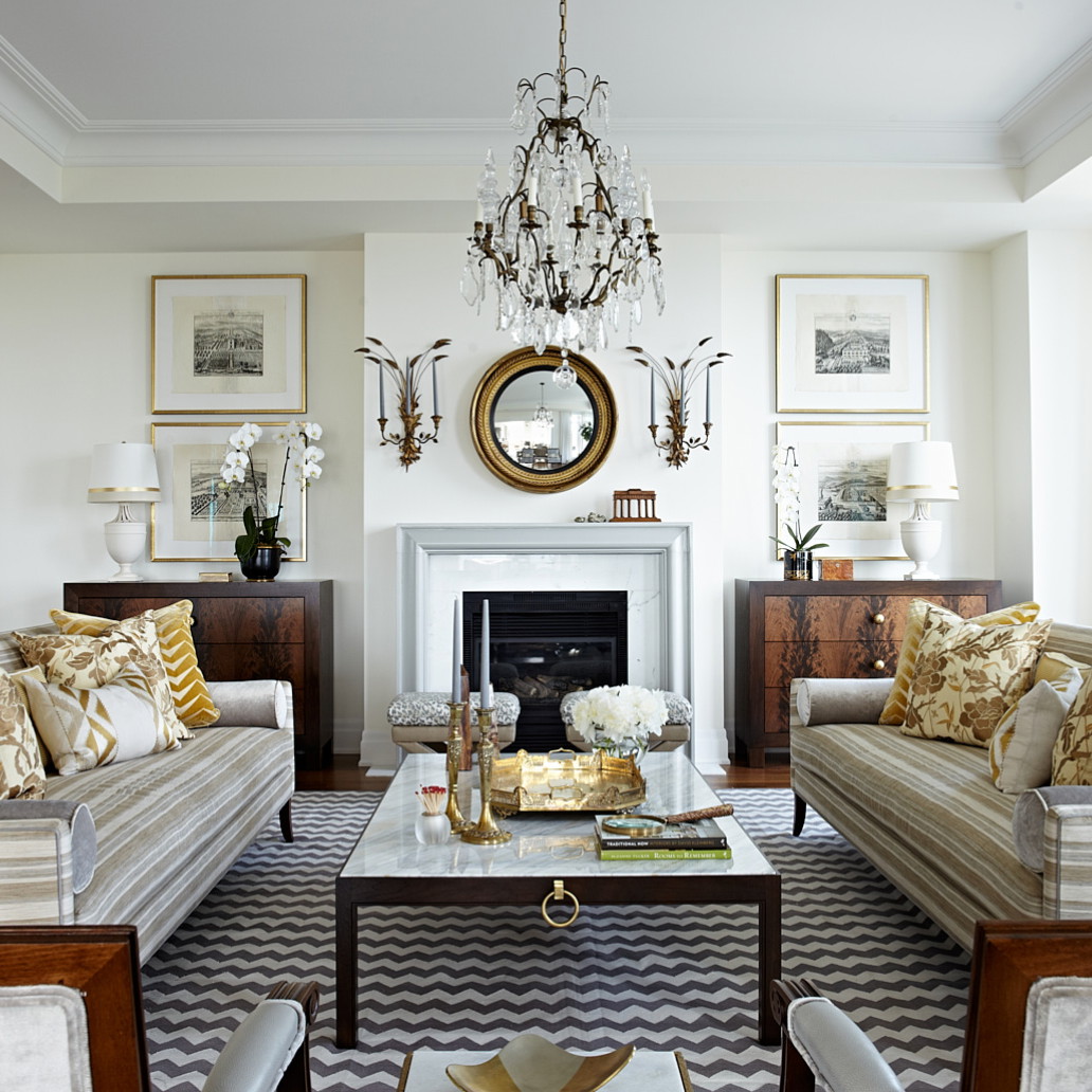 a living room filled with furniture and a fire place