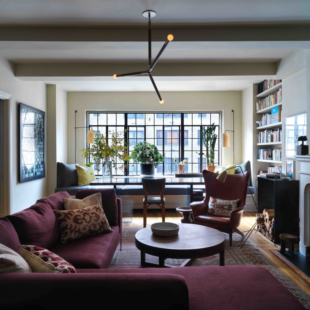 a living room filled with furniture and a fire place