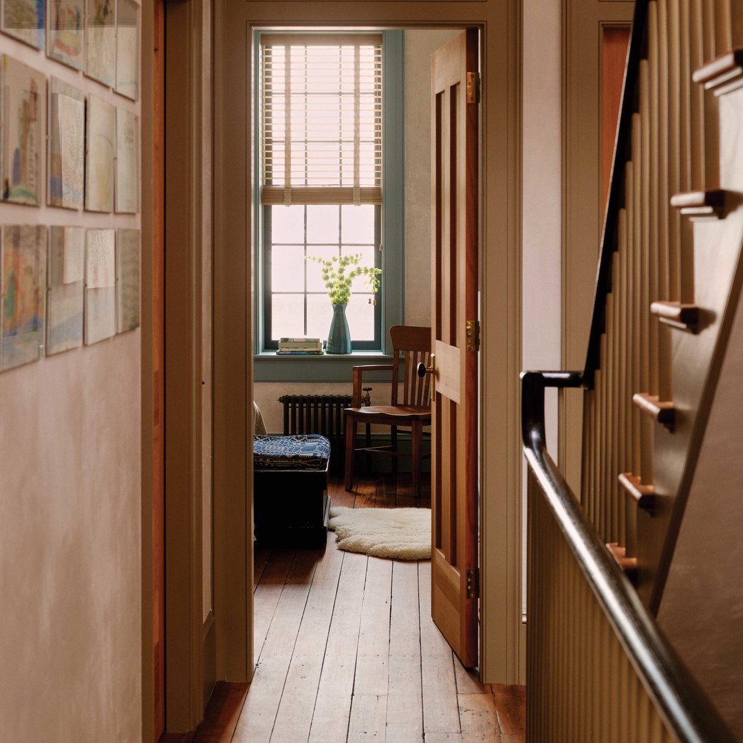 a hallway leading to a living room and dining room