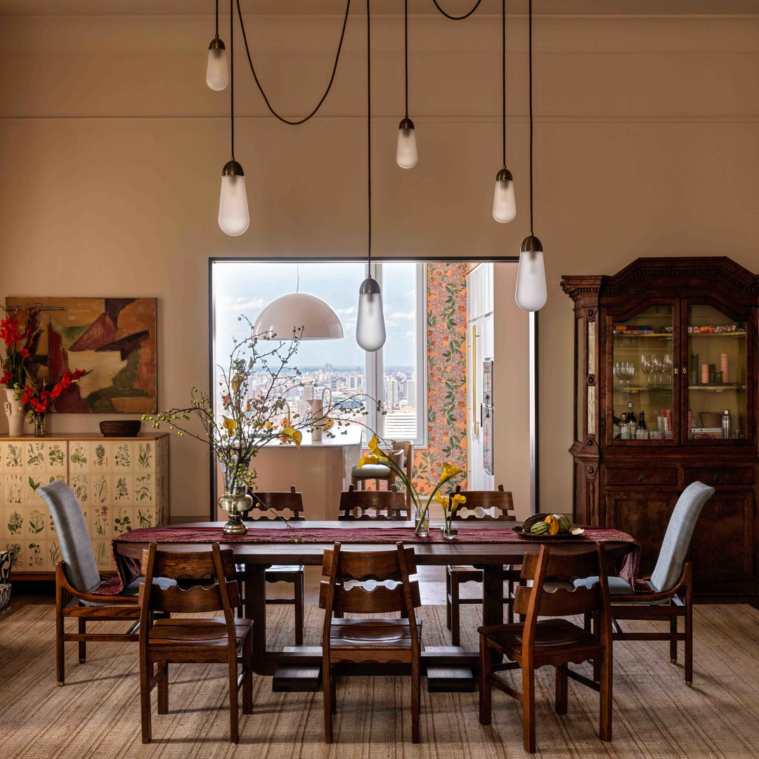 a dining room with a table and chairs