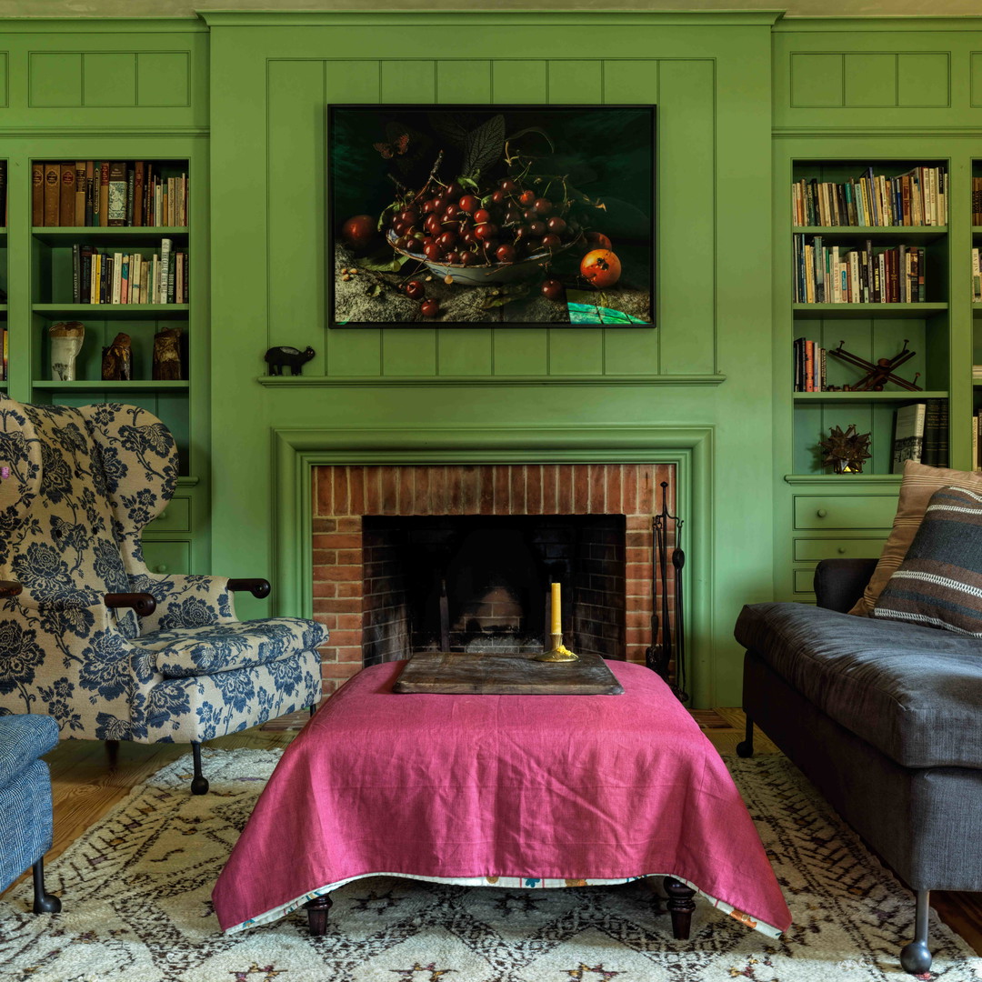 a living room filled with furniture and a fire place