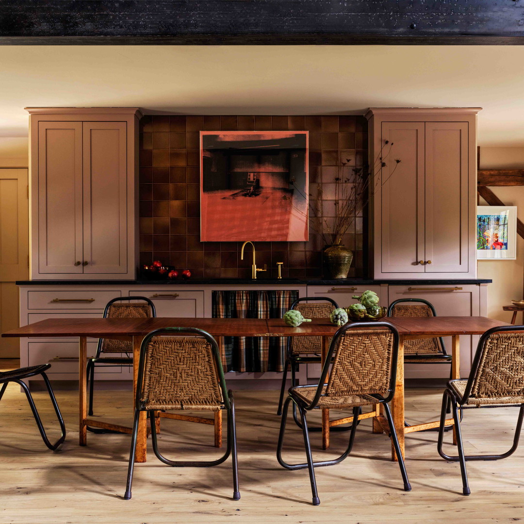 a dining room with a table and chairs