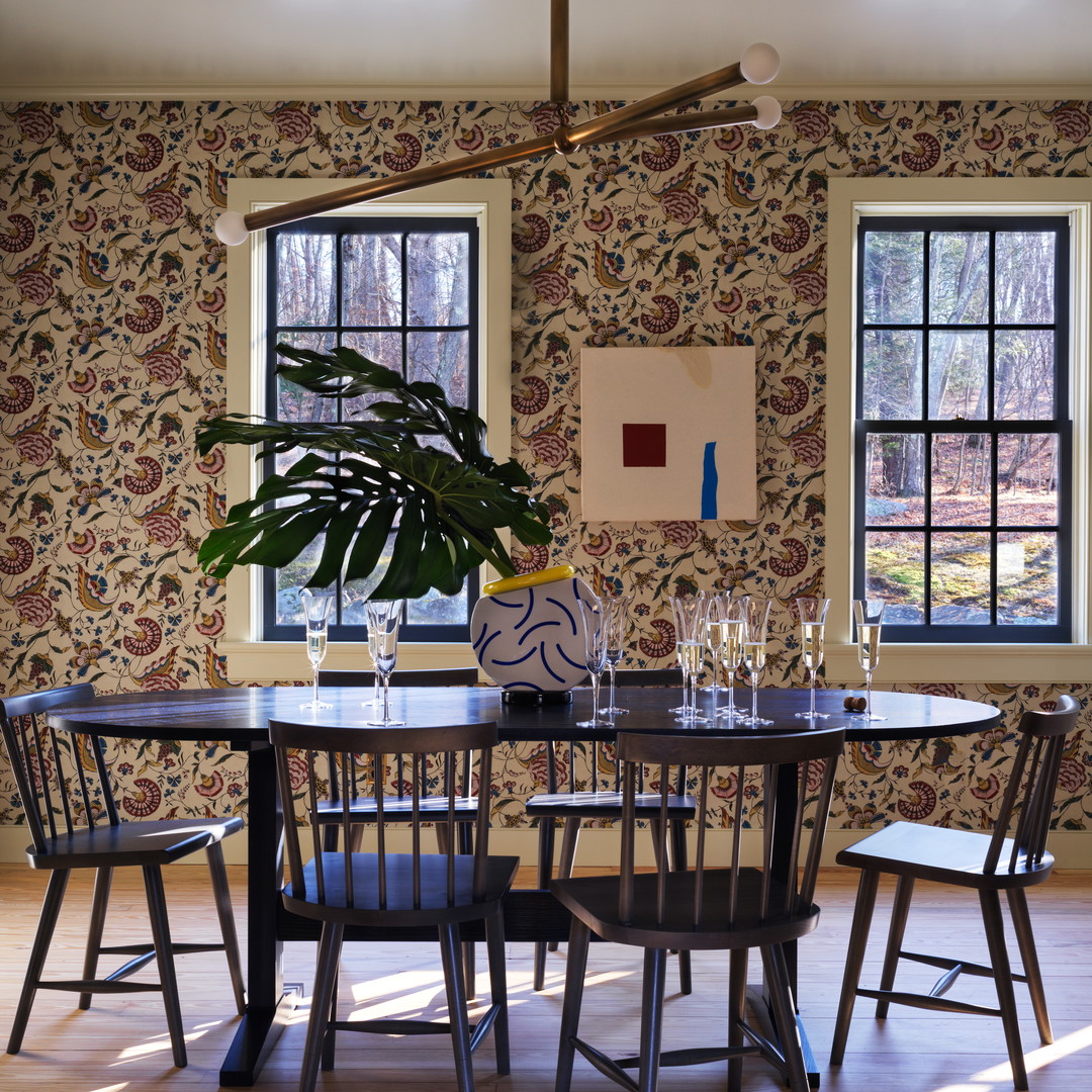 a dining room with a table and chairs