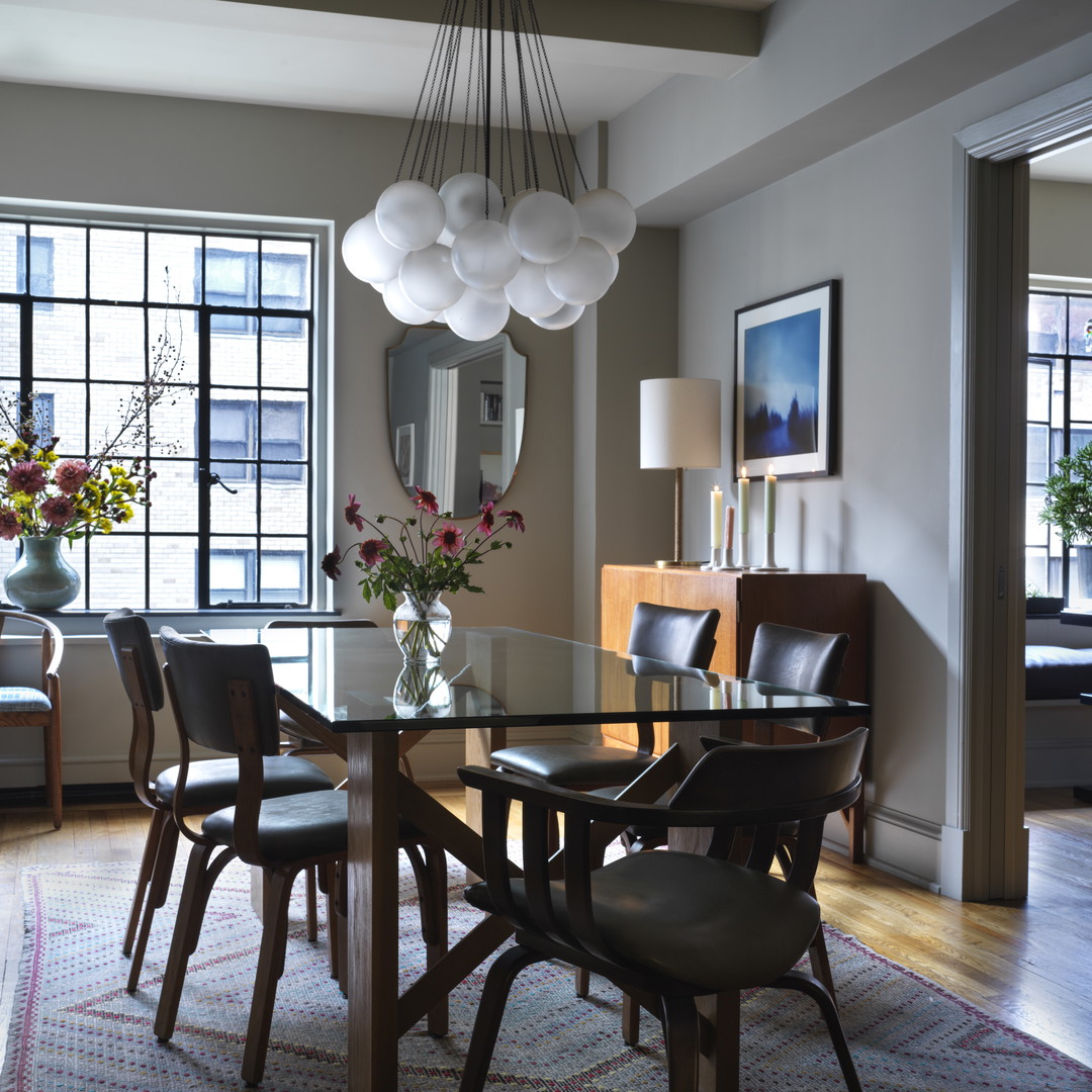 a dining room with a table and chairs