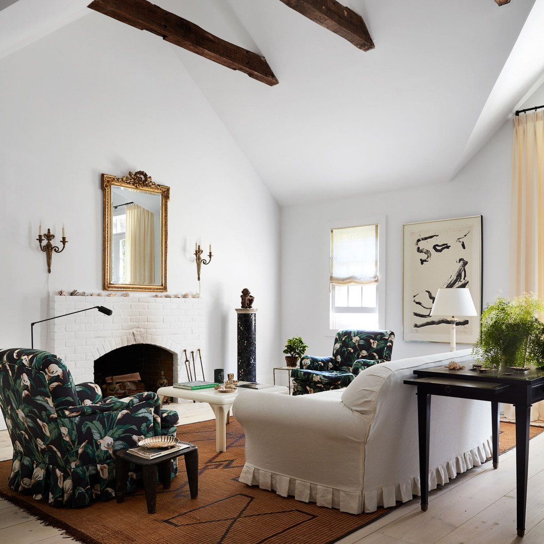 a living room filled with furniture and a fire place