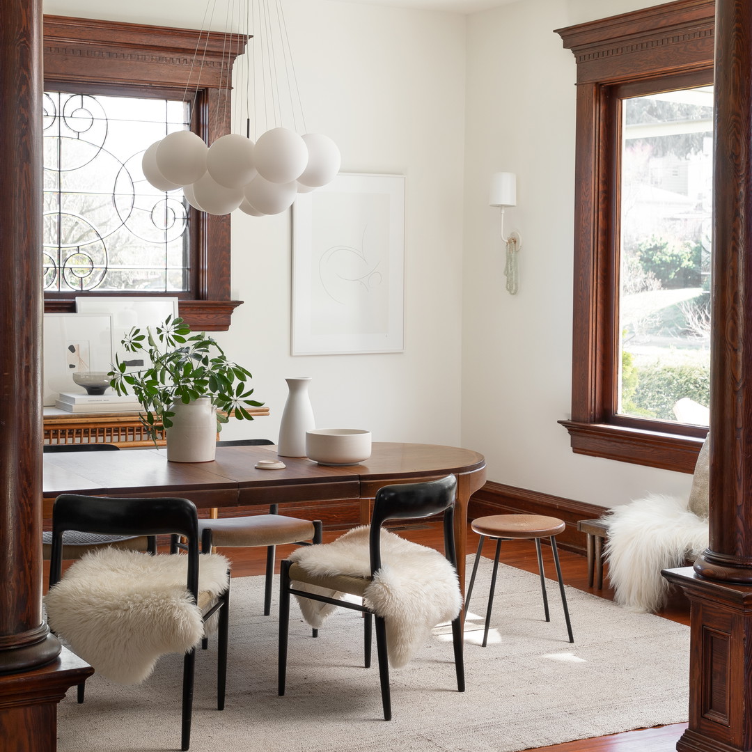 a dining room with a table and chairs