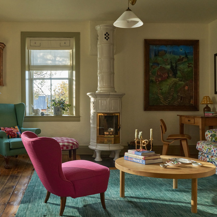 a living room filled with furniture and a fire place