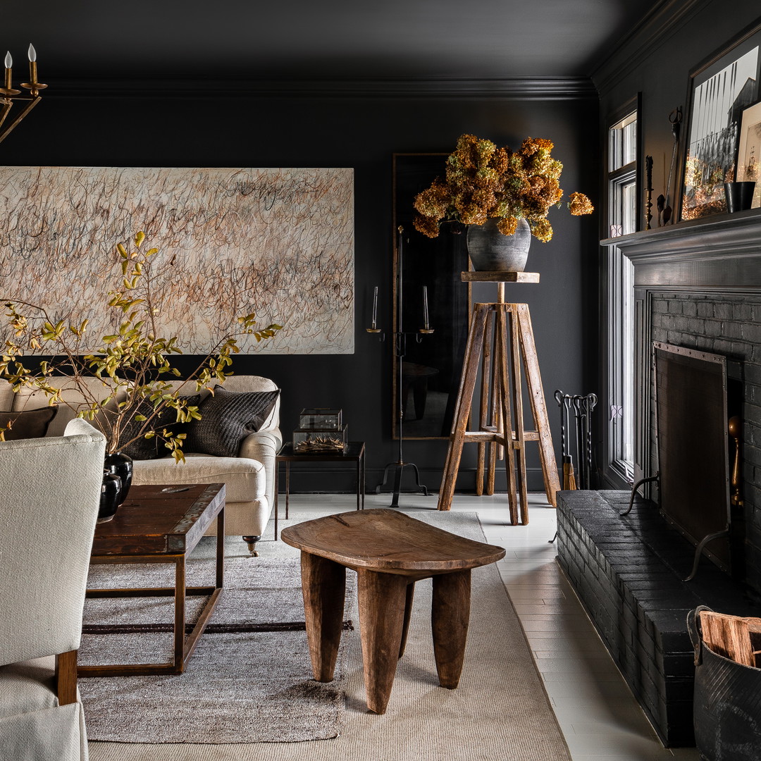 a living room filled with furniture and a fire place