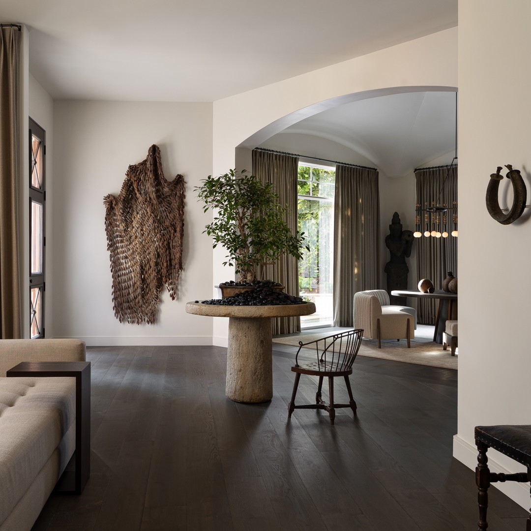 a living room filled with furniture and a table