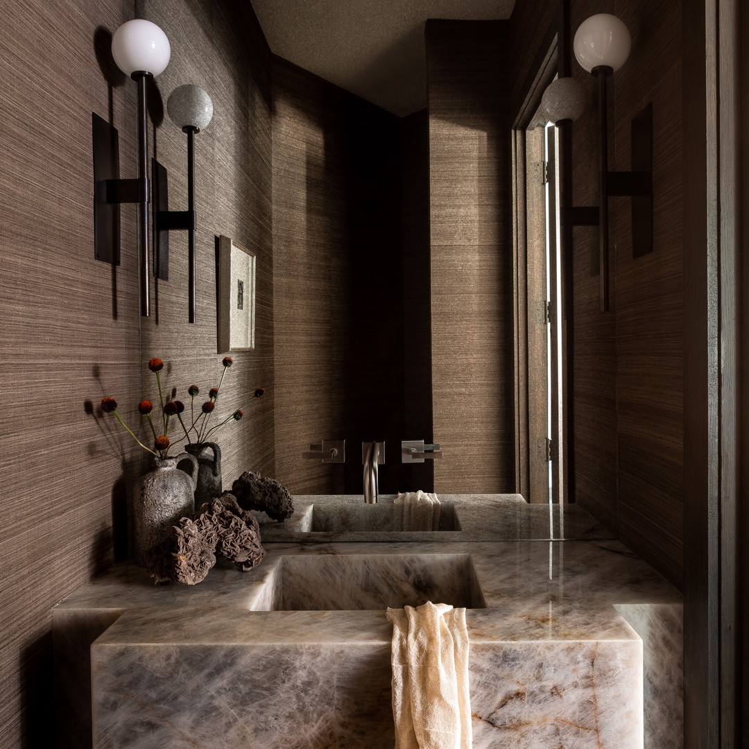 a bathroom with two sinks and a mirror