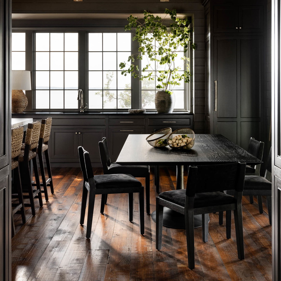 a dining room with a table and chairs