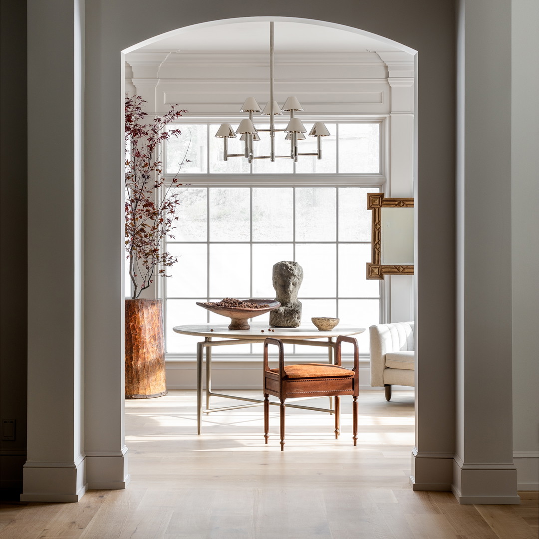 a dining room with a table and chairs