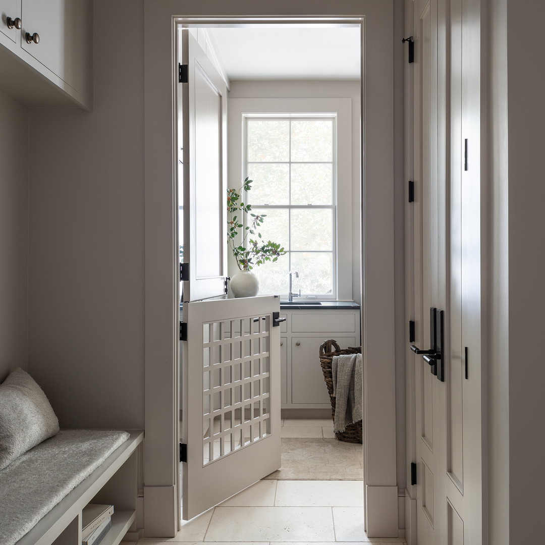 a hallway with a bench and a potted plant