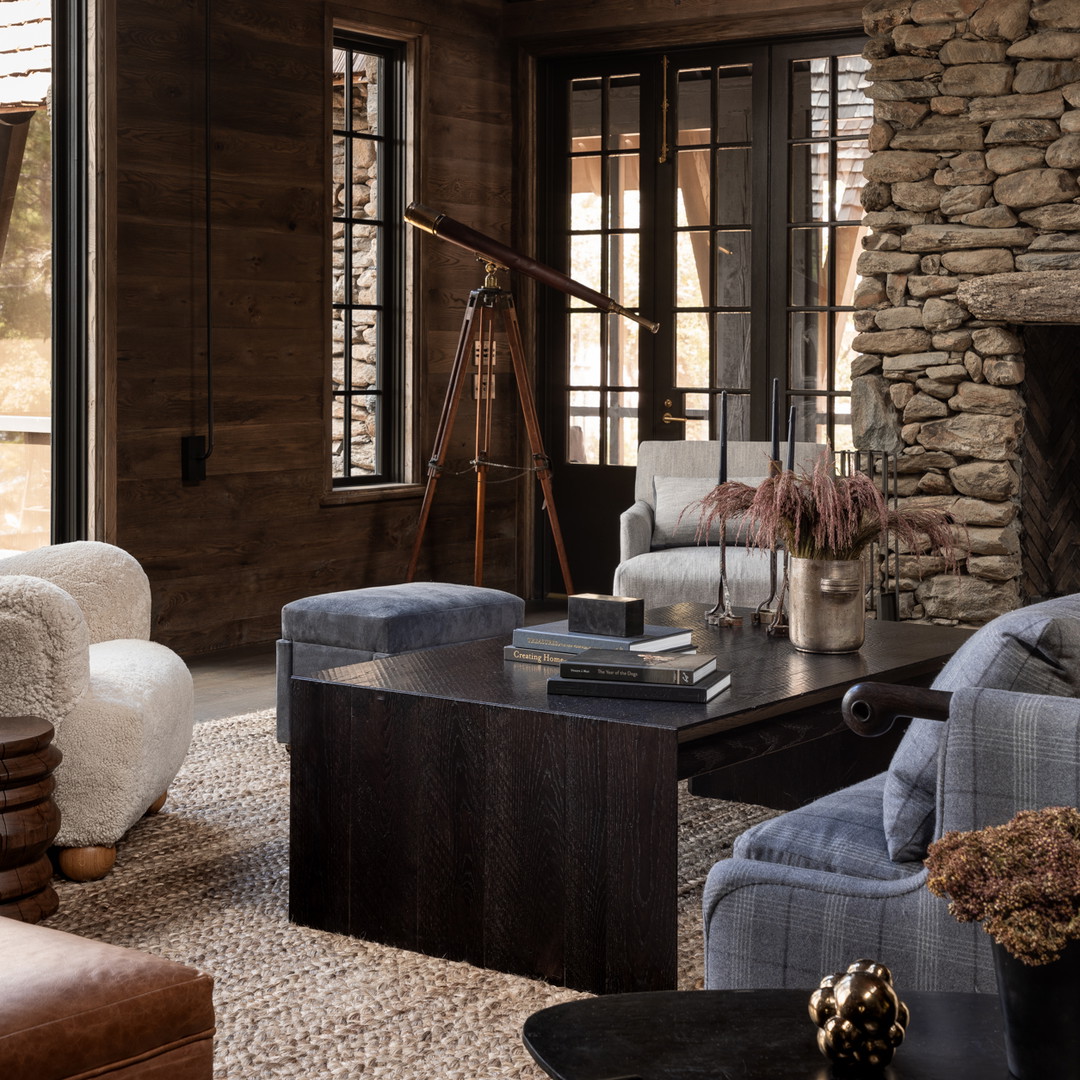 a living room filled with furniture and a fire place