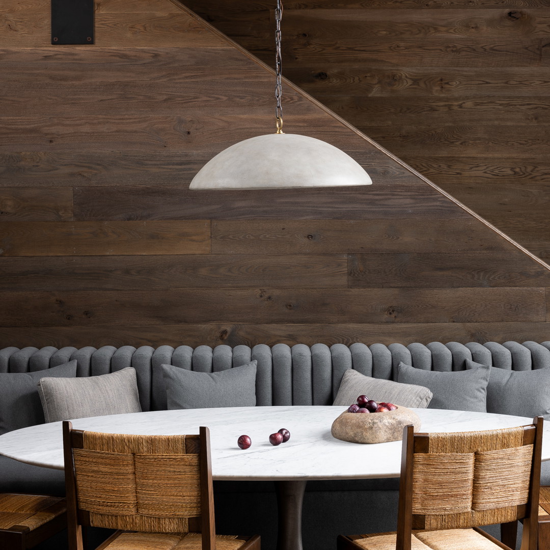 a dining room table with chairs and a bench