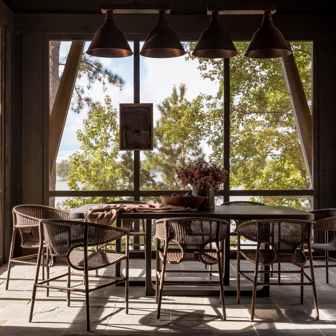 a dining room with a table and chairs