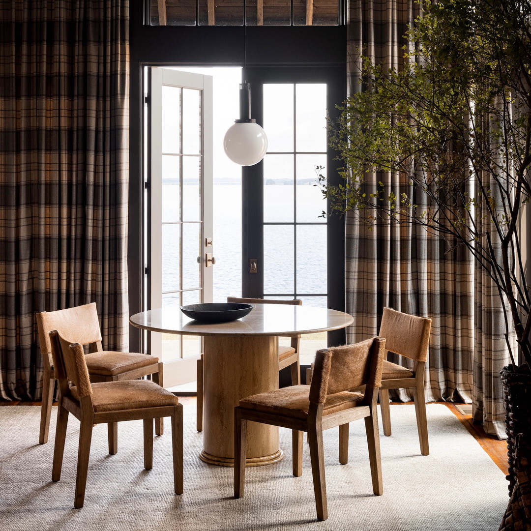 a dining room with a table and chairs