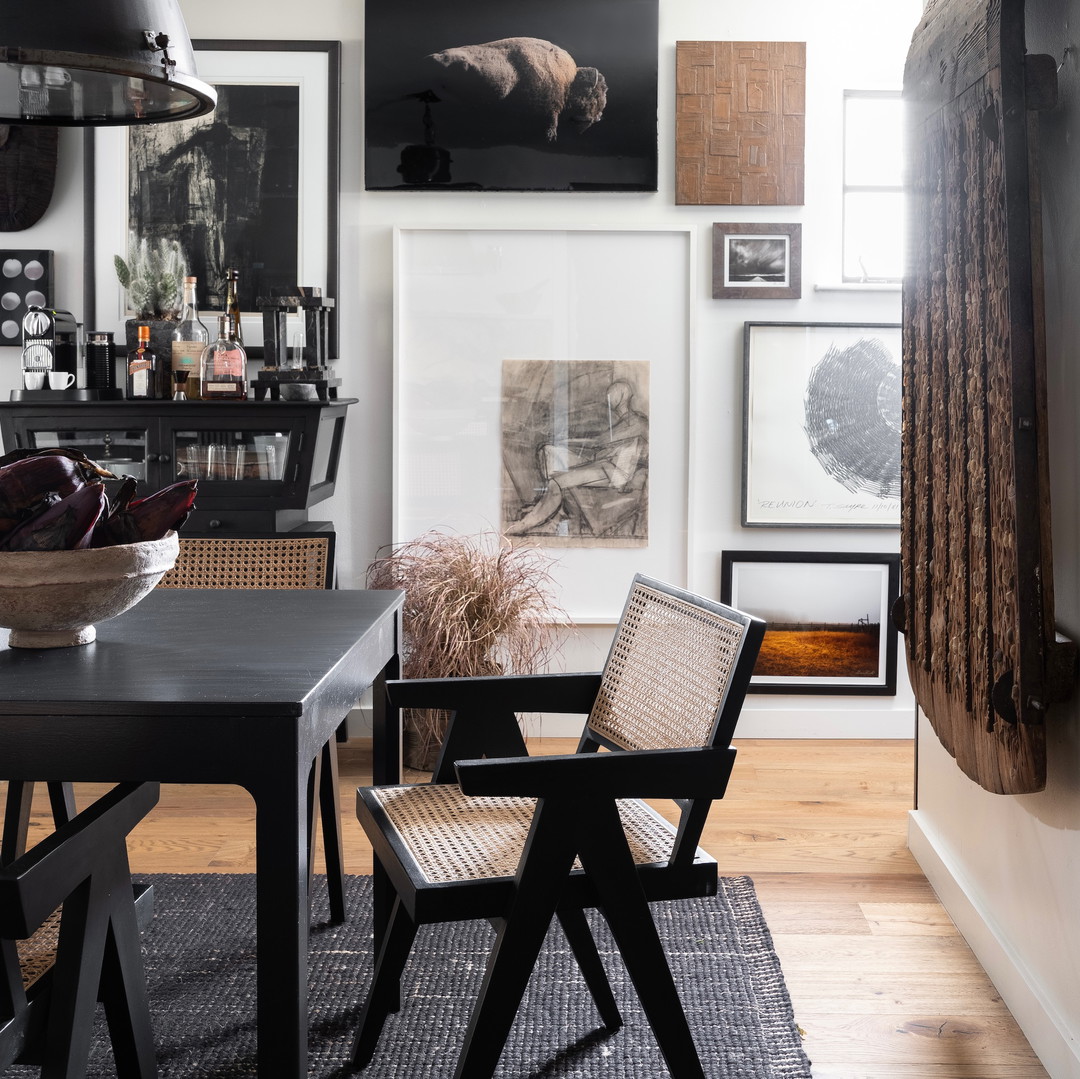 a dining room with a lot of pictures on the wall