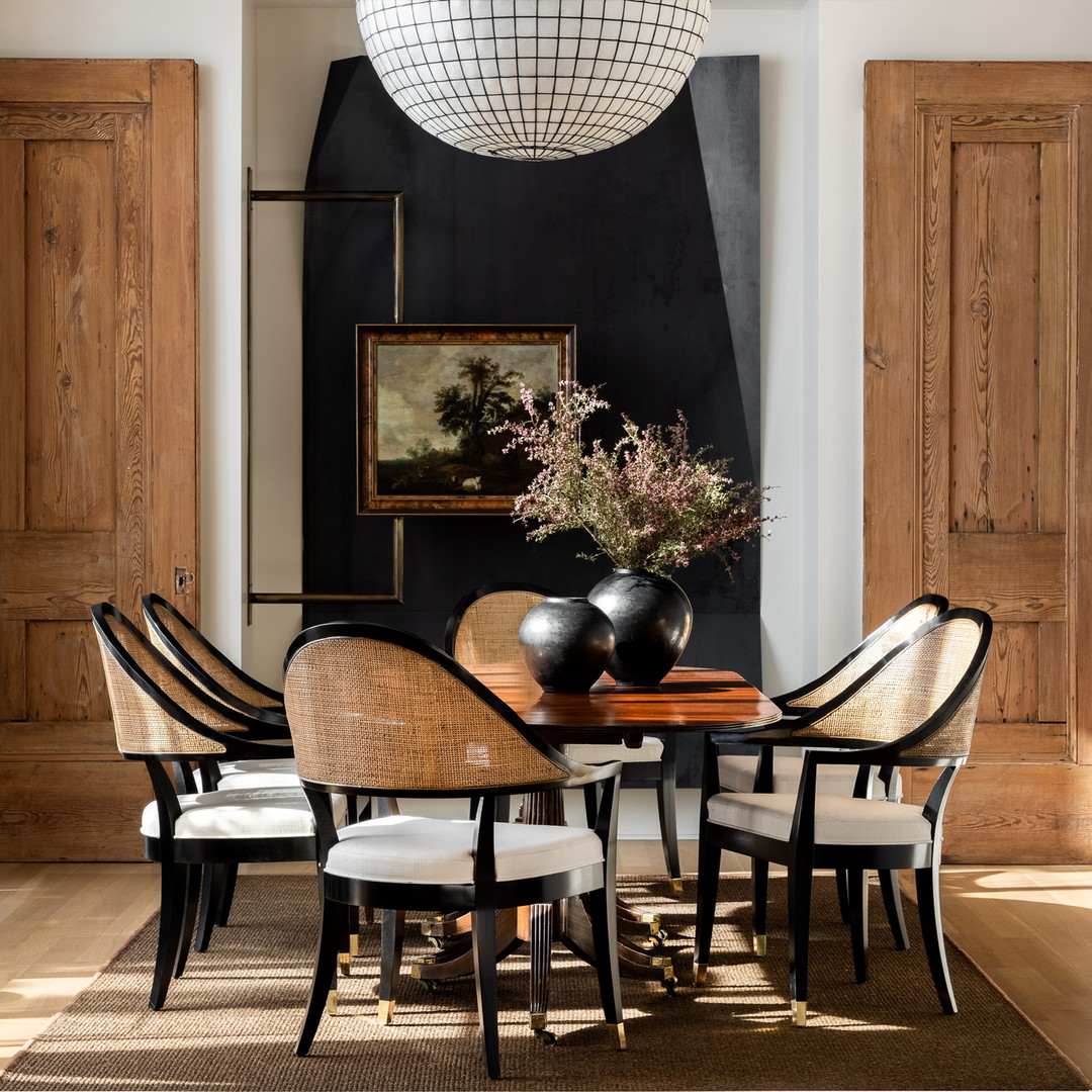 a dining room with a table and chairs