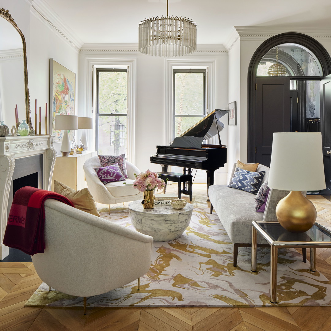 a living room filled with furniture and a piano