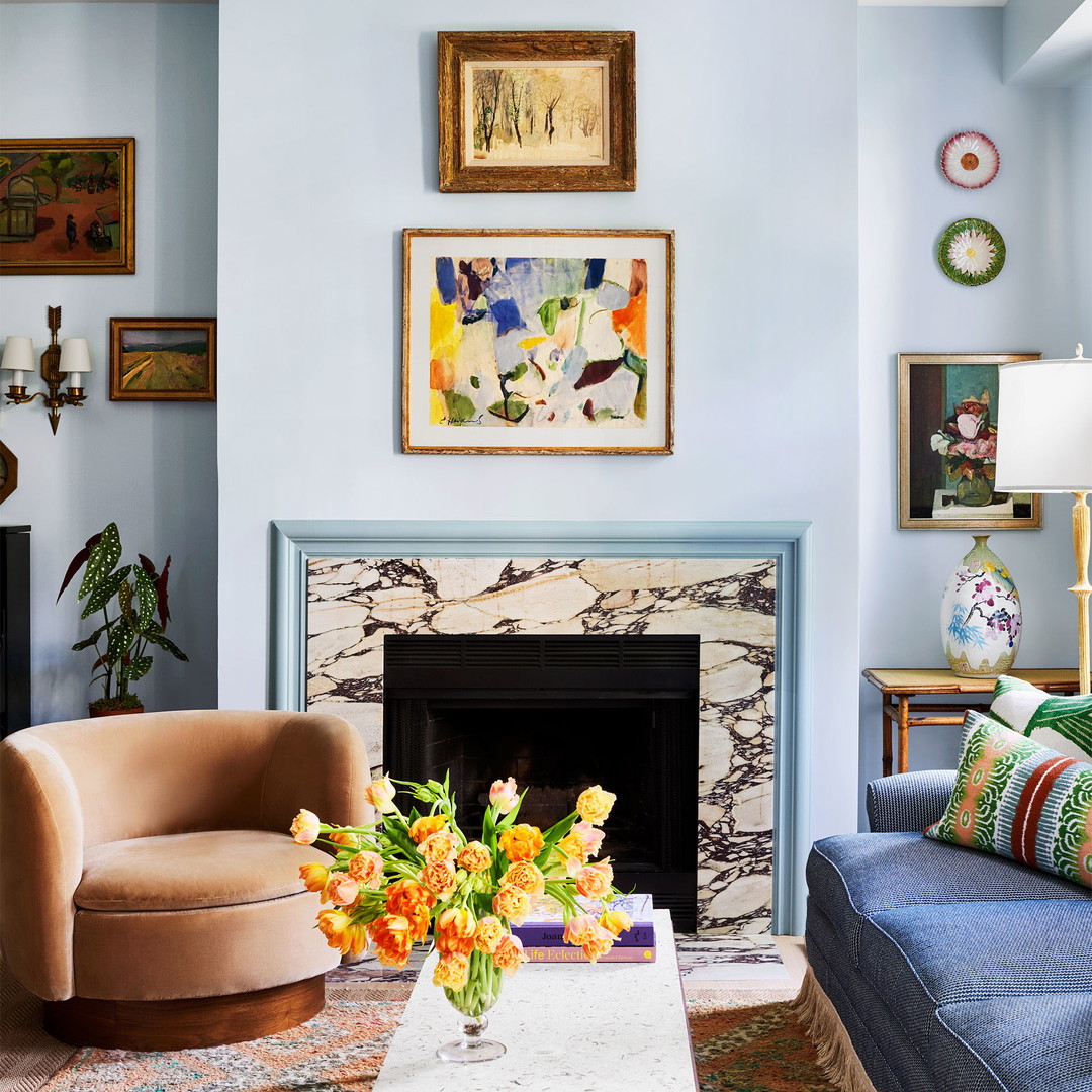 a living room filled with furniture and a fire place