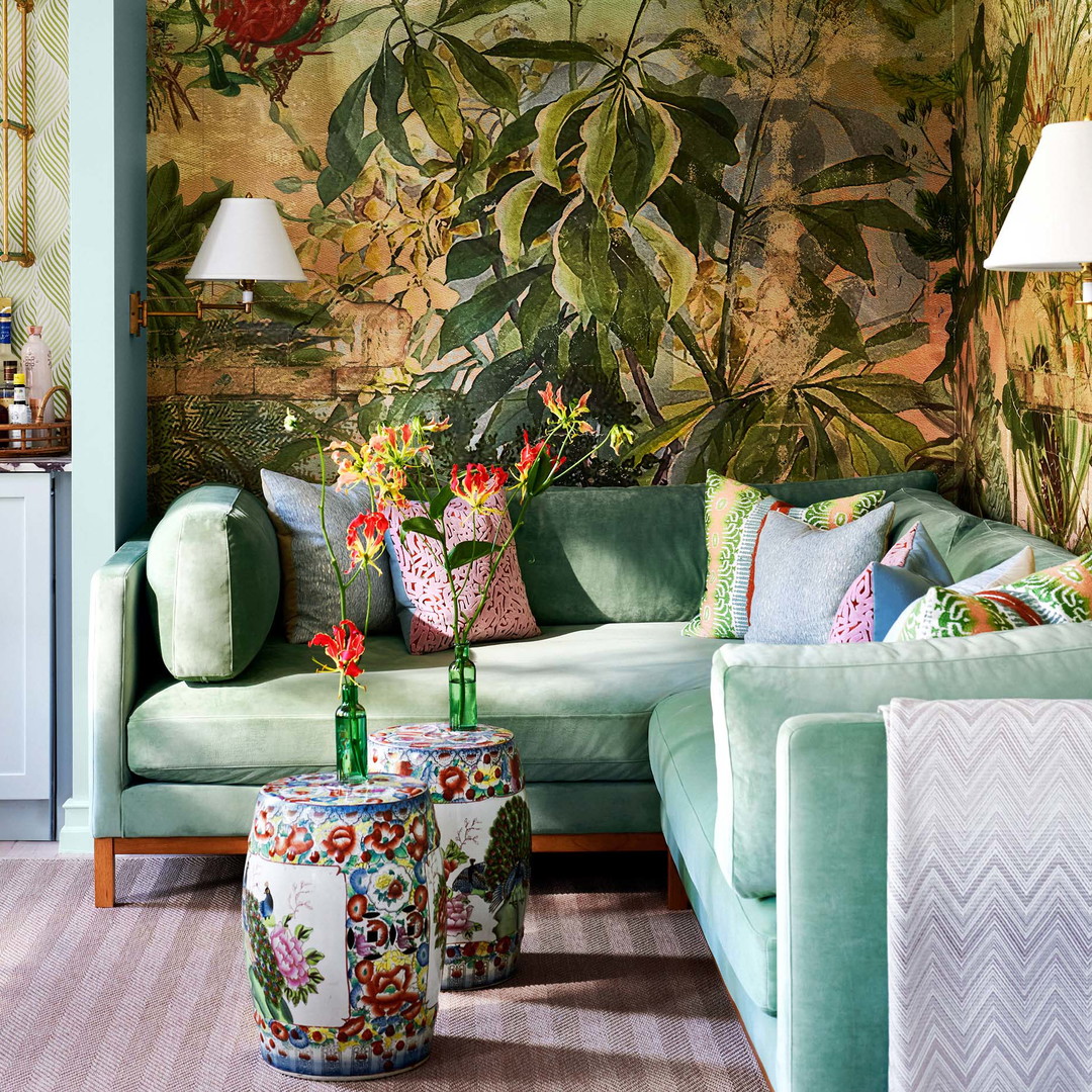 a living room filled with furniture and a painting on the wall