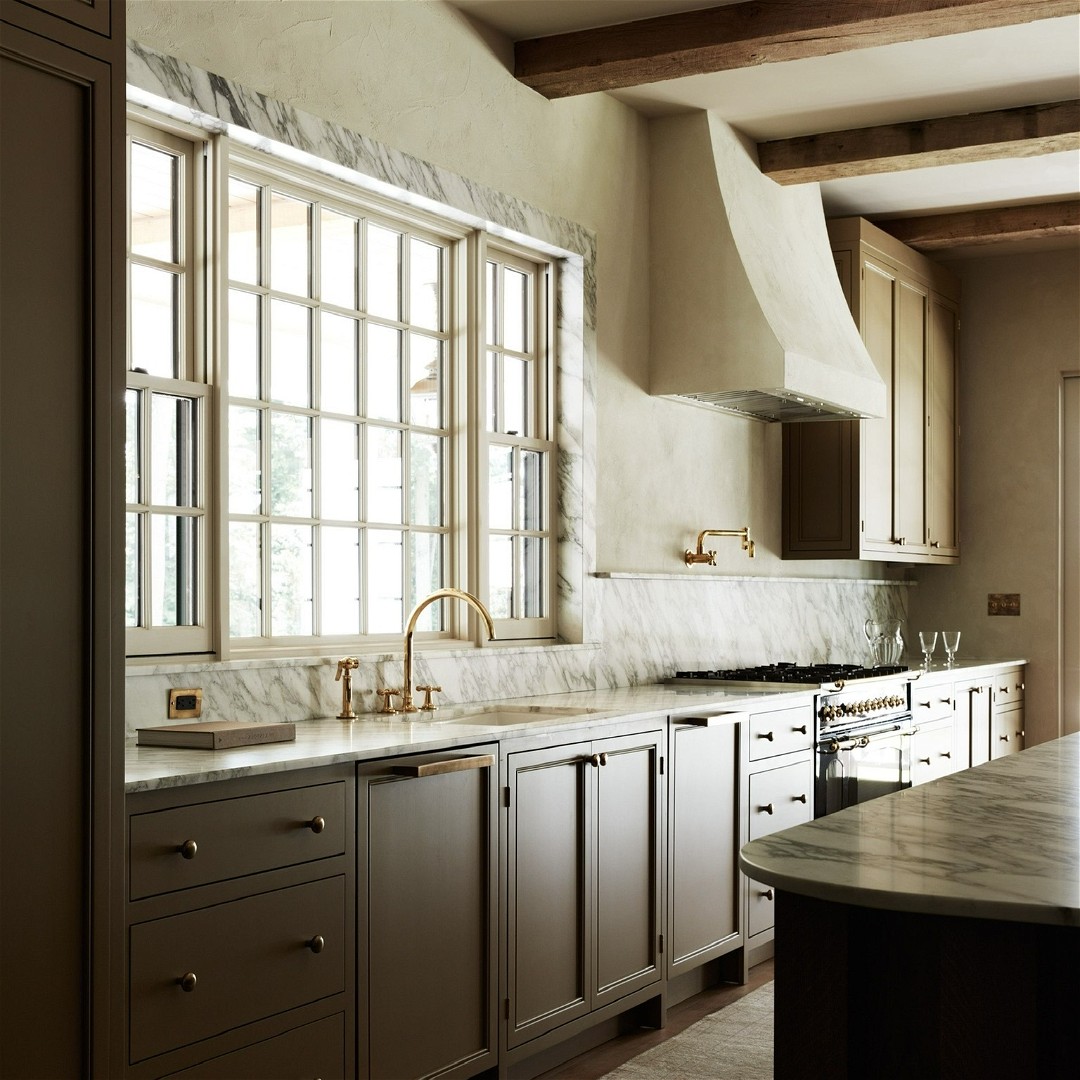 a large kitchen with a marble counter top