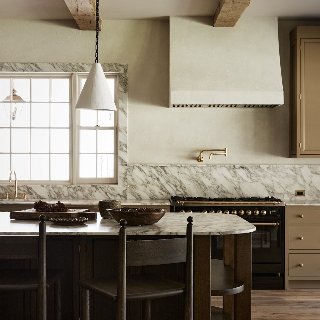 a kitchen with a marble counter top and island