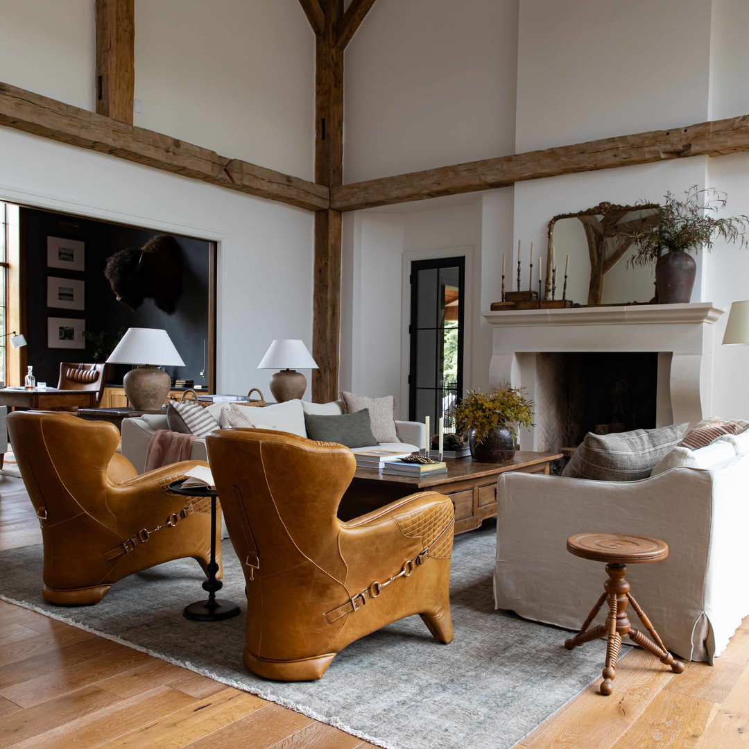 a living room filled with furniture and a fire place