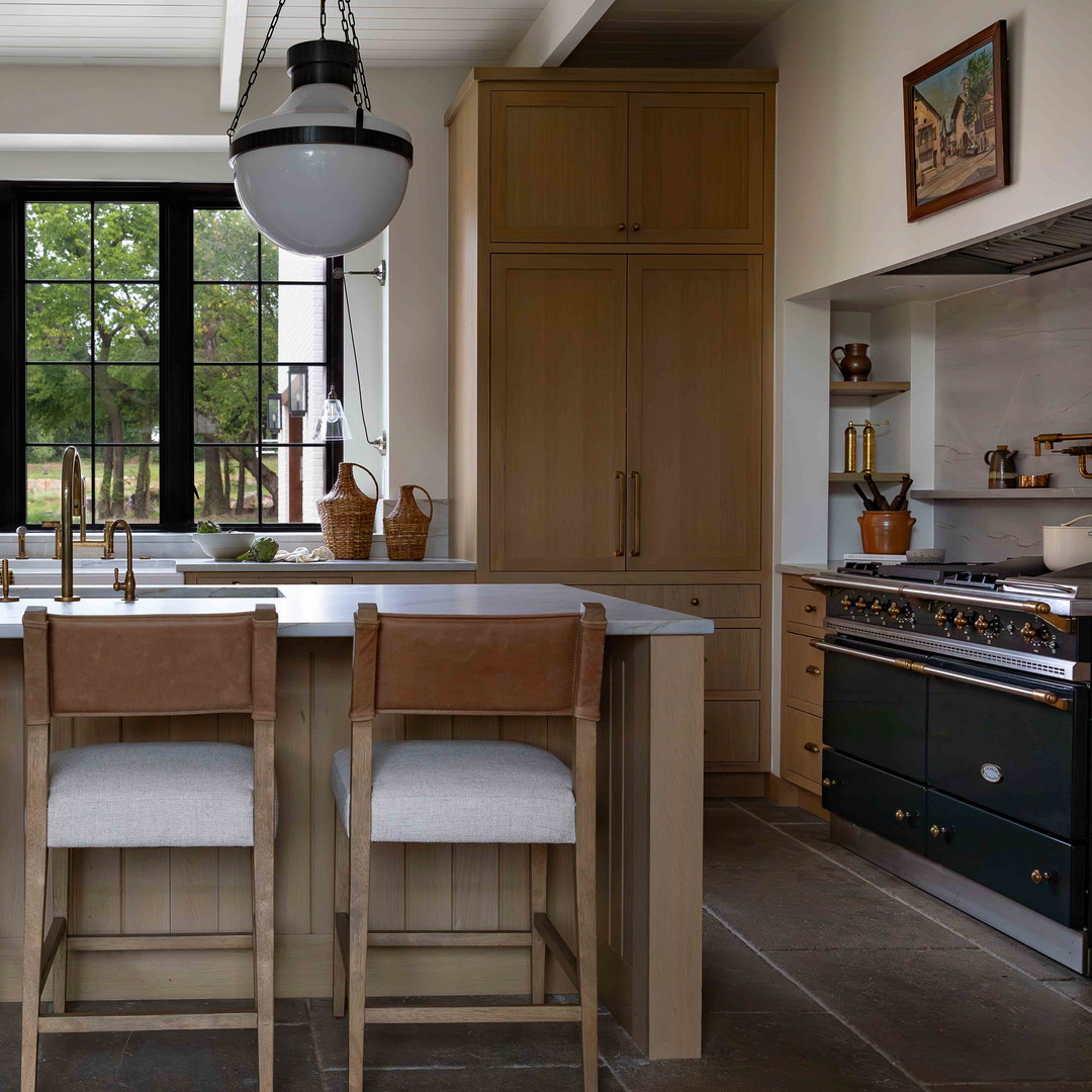 a kitchen with a center island and a stove top oven