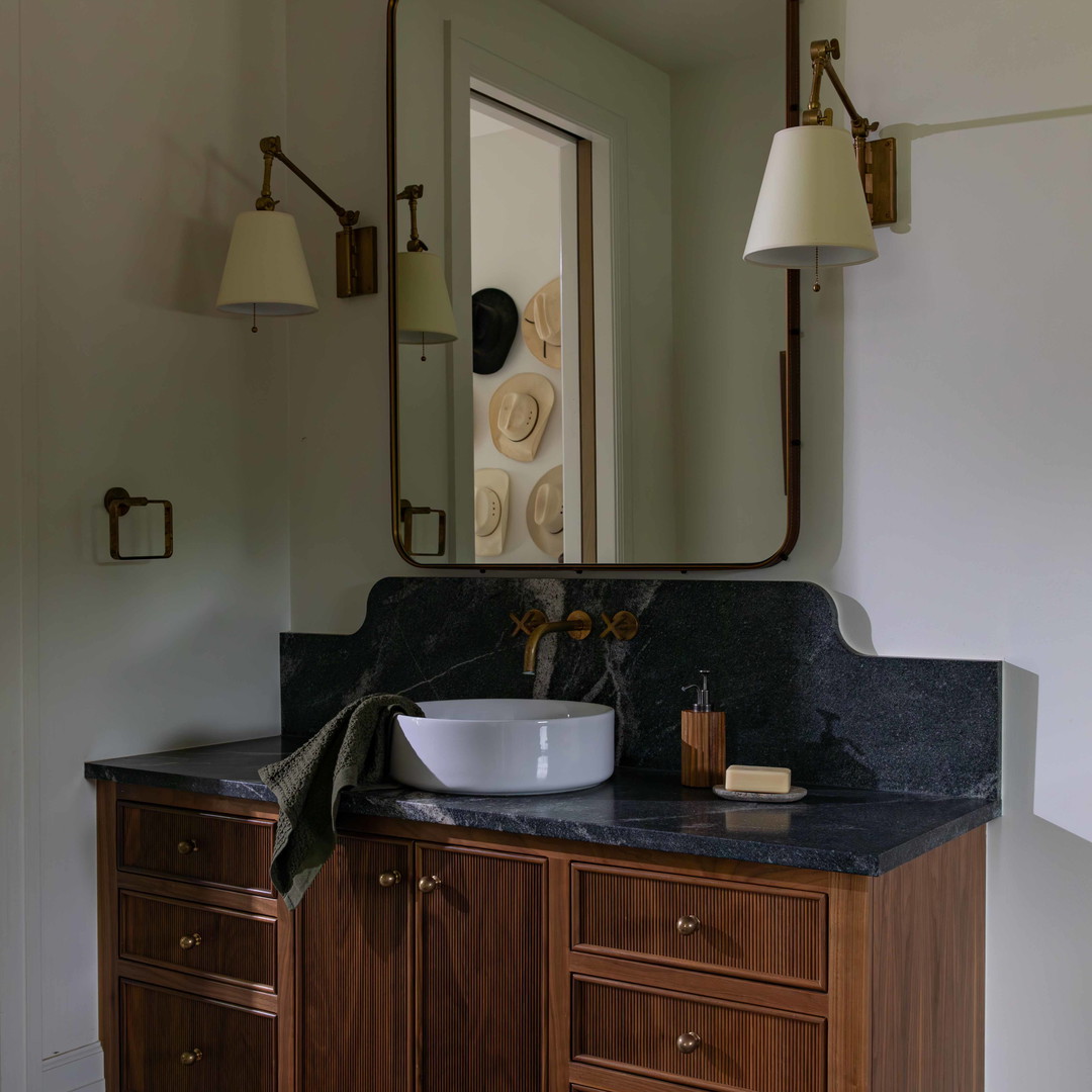 a bathroom with a sink and a large mirror