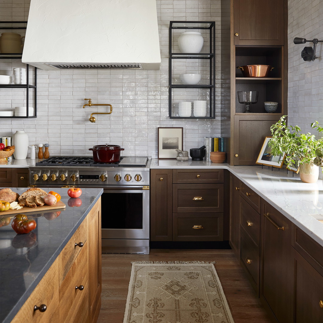 a kitchen with a stove top oven and a sink