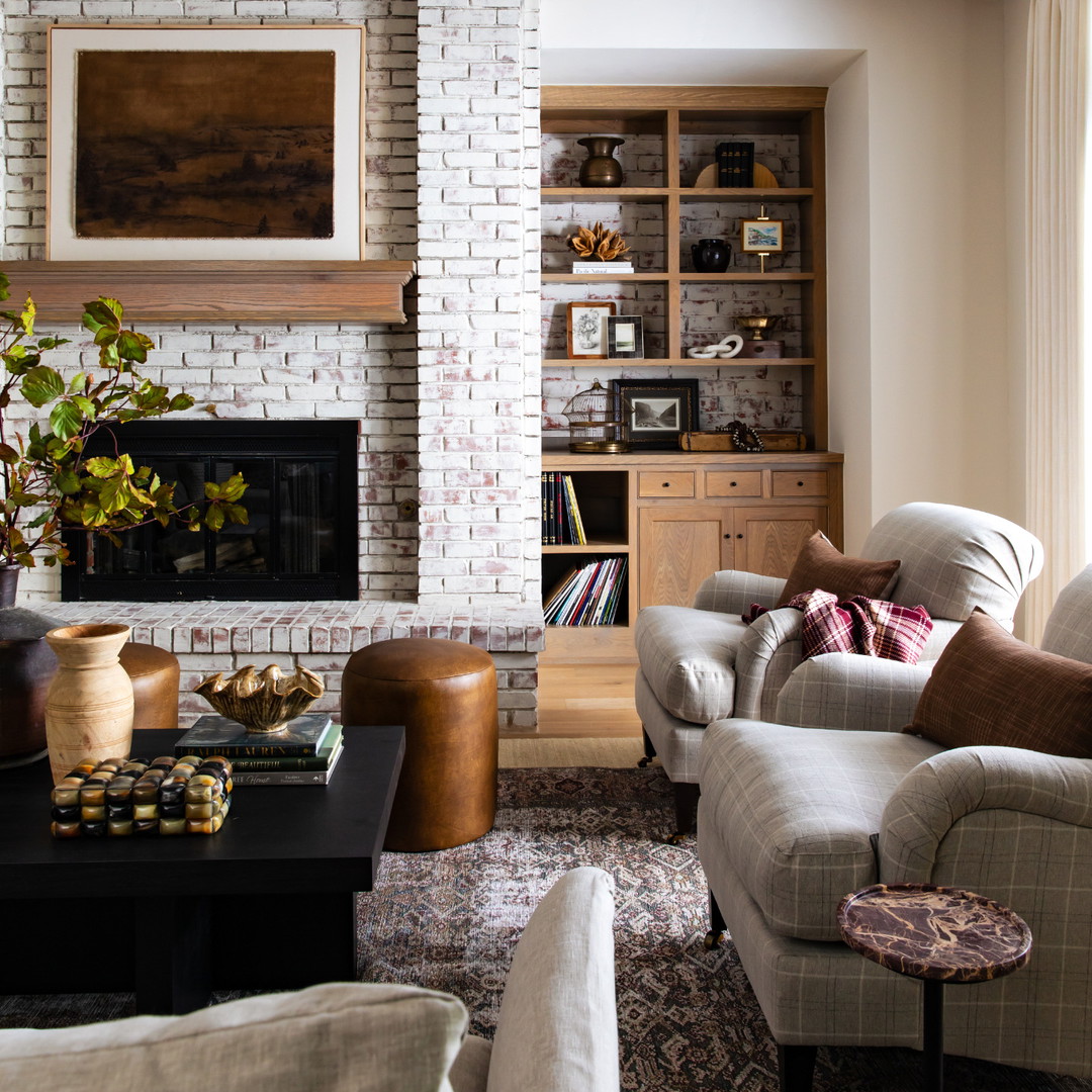 a living room filled with furniture and a fire place