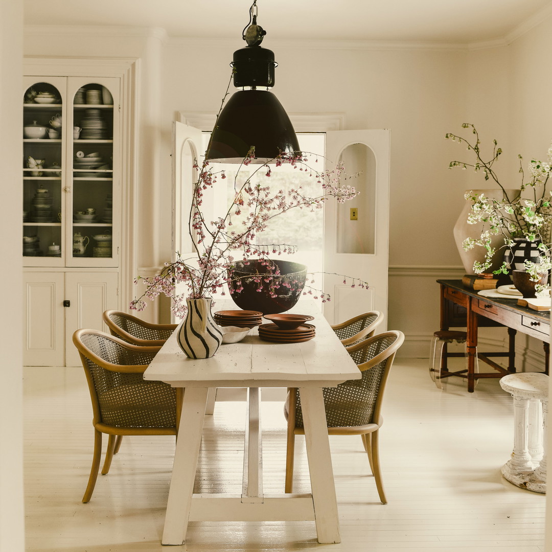 a dining room with a table and chairs