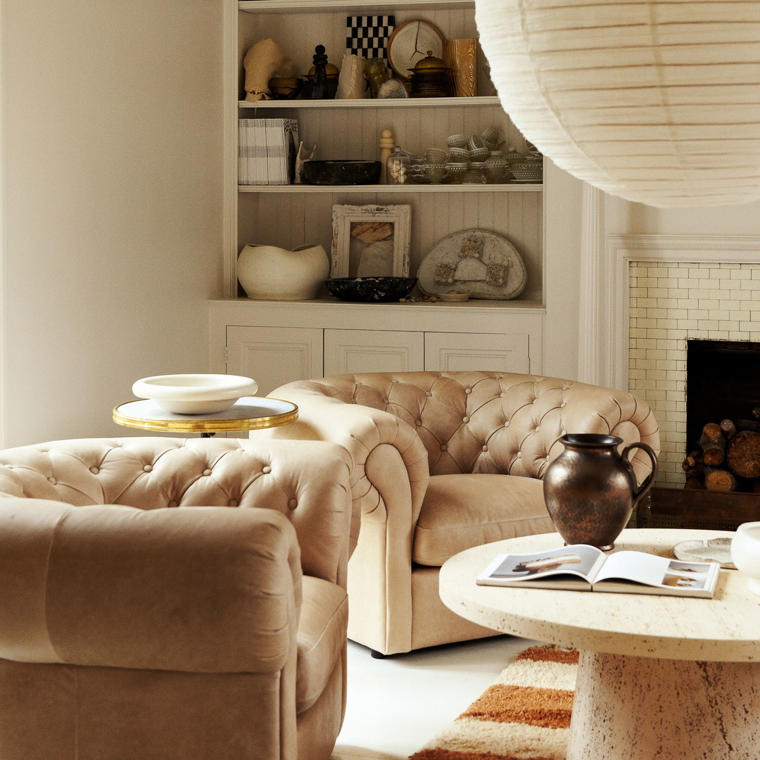 a living room filled with furniture and a fire place