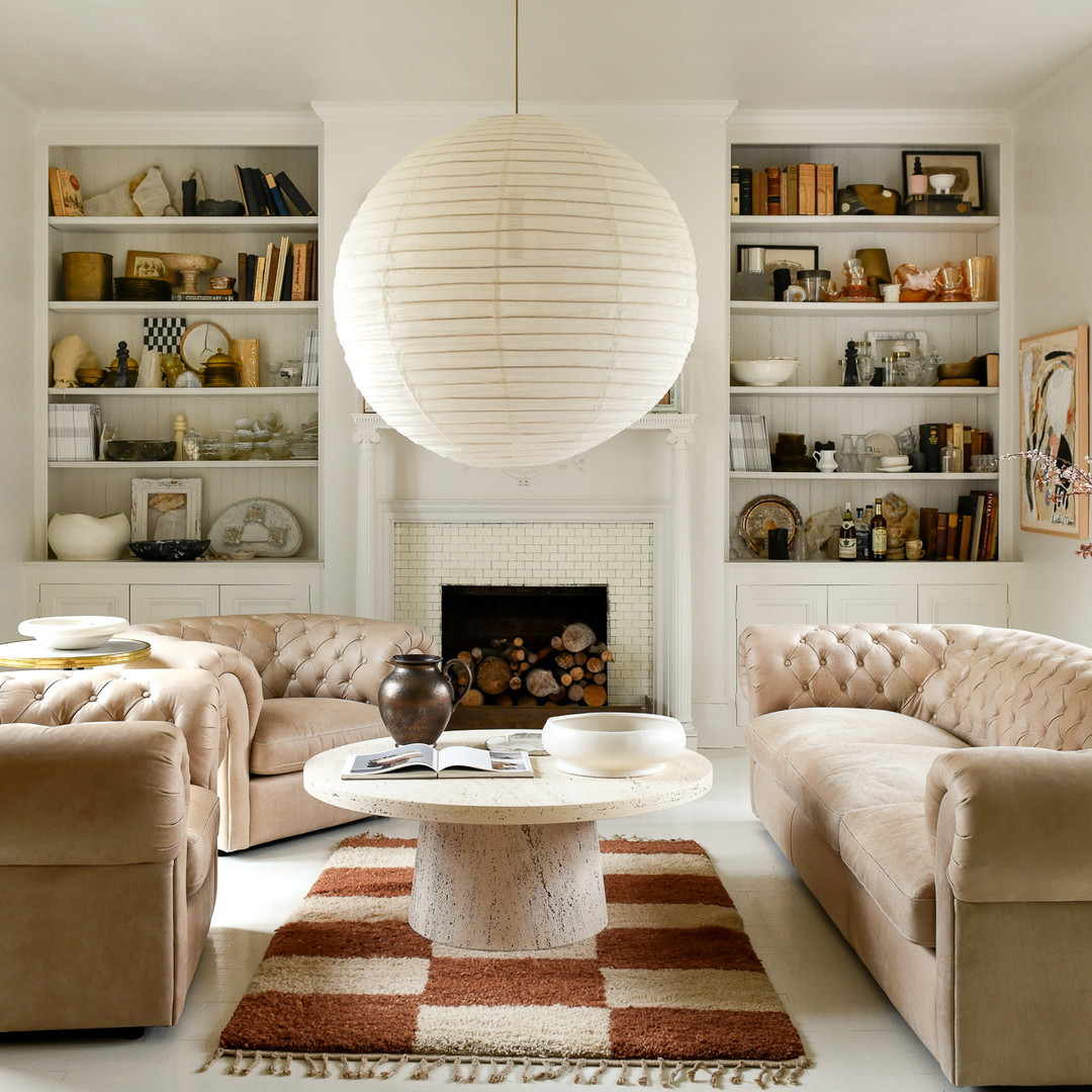 a living room filled with furniture and a fire place