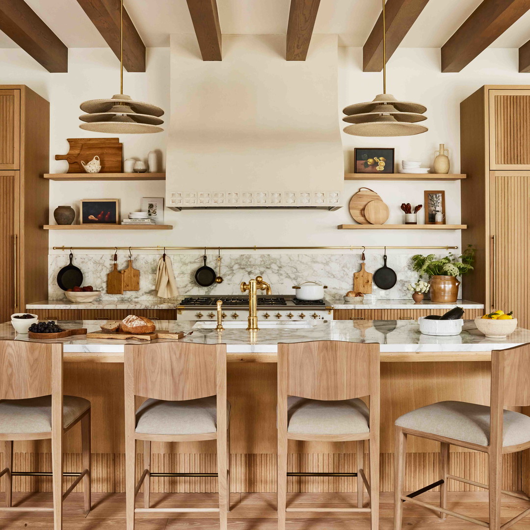 a large kitchen with a center island and wooden cabinets