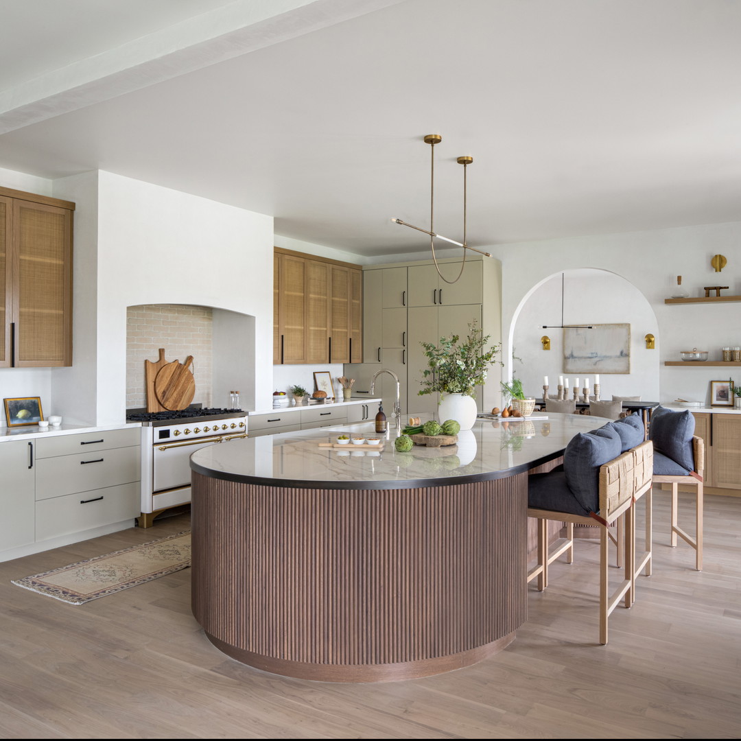 a large kitchen with a center island in the middle of the room